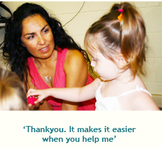 Carer saying to a child "Thank you. It makes it easier when you help me".