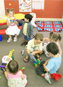 group of children of varying ages playing at a childcare centre