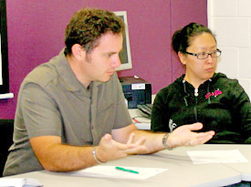 Close-up image of Ryan talking at the staff meeting.