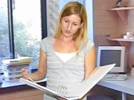 Nicole looking at Curtis's portfolio.