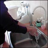 hand washing with soap and water.