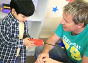 a caregiver communicating individually with a child.