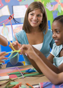 children using pipe cleaners, bottle tops and other creative materials.