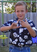 boy using sign language.