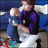 Woman lifting the baby