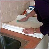 Woman cleaning the change area