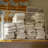 piles of nappies on a shelf.