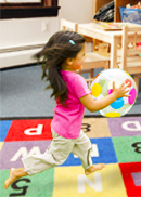 a child running in a childcare centre.