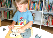 a toddler solving a simple puzzle.